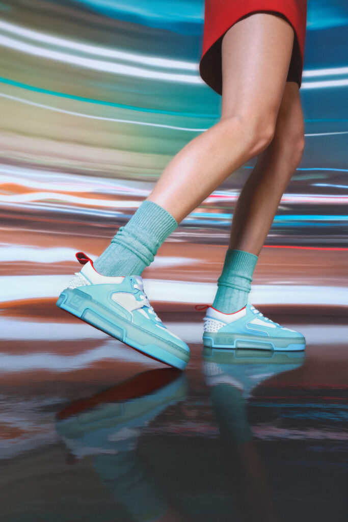 After making its debut in the Paris Fashion Week, this spunky collection has finally arrived in India. Christian Louboutin's latest creation, The ASTROLOUBI, draws inspiration from the bold trends of the 90s. Reminiscent of iconic basketball and skate sneakers from that era, these shoes pay homage to a time when fashion was fearless. The ASTROLOUBI is not just a tribute; it's a modern reinvention. Christian Louboutin Astroloubi sneakers Available in five captivating colorways, the collection ranges from vibrant 90s hues to soothing pastels and a sleek minimalist version, each iteration is a testament to the fusion of materials and textures. While giving off a cool streetwear vibe, the sneakers flaunt luxurious calfskin leather, supple suede, sleek satin, and laminated nappa blend. The collection features bold graphic lines, distinctive spikes embellishing the back counter, a vibrant outsole adorned with the 'CL' varsity logo, and, naturally, the iconic red sole, a representation of Maison's unique style. Christian Louboutin Astroloubi sneakers The sneaker is 20% lighter than its all-leather counterparts. The design prioritizes weightlessness with a lycra-covered open foam Loubi red footbed, promoting breathability and relaxation. The shoe also boasts a fast-drying red lining, ideal for those seeking durability on the court. 